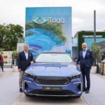Togg Chairman Fuat Tosyali (R) and Togg CEO Gurcan Karakas (L), Togg T10F Sedan (C) at IAA Mobility 2025 in Munich, Sept. 9, 2025. (Photo via Togg)